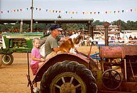[color photograph of tractor exhibition, Cecil County Fair]